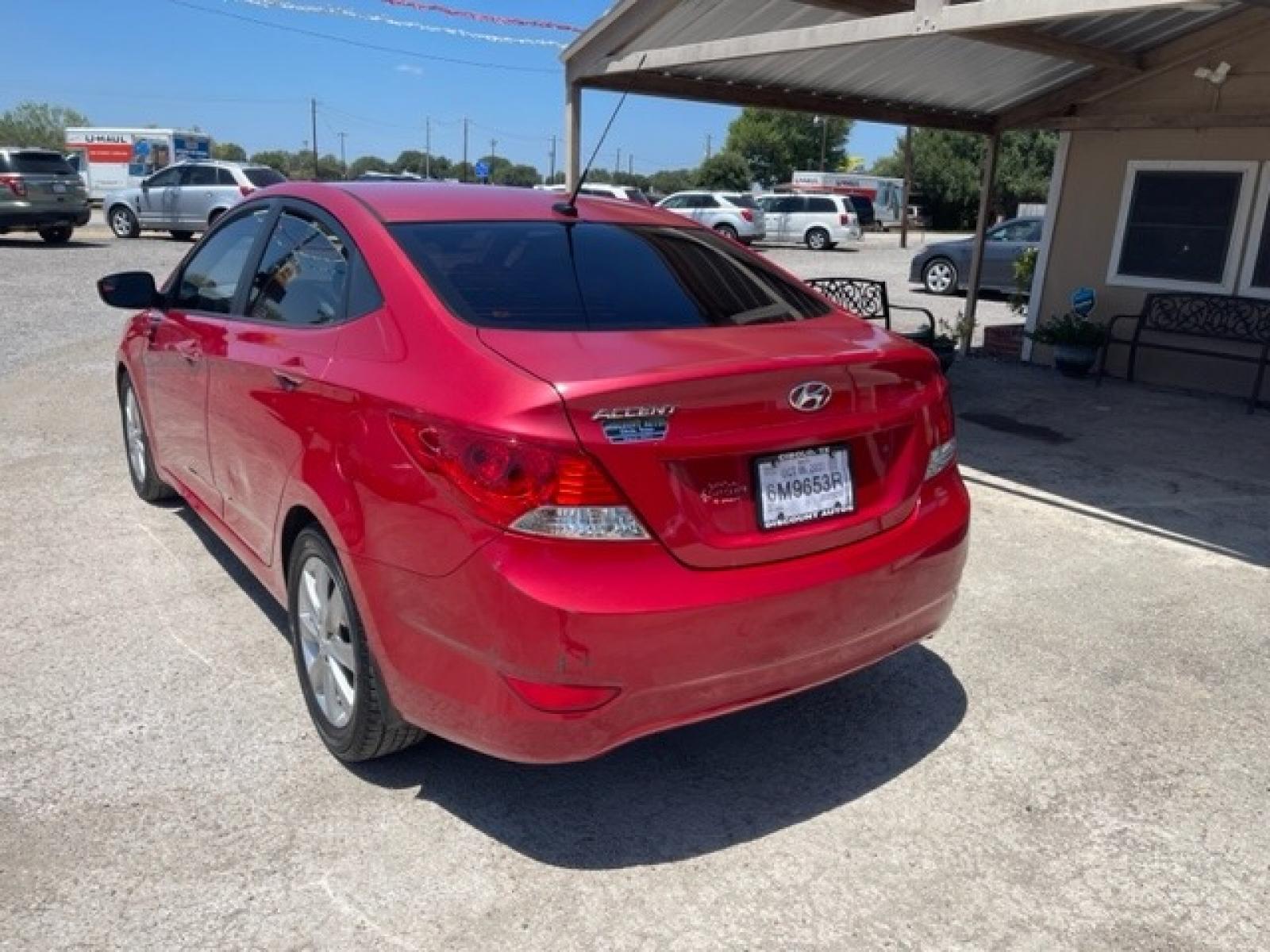 2014 RED HYUNDAI ACCENT GLS (KMHCU4AE8EU) with an 1.6L engine, Automatic transmission, located at 124 Elm St., Cibolo, TX, 78108, (210) 658-3118, 29.559427, -98.232384 - www.discountautosinc.com TEXT QUESTIONS TO 210-900-3118 35 MONTHLY PAYMENTS OF $285 WITH $1695 DOWN AND FINAL ODD PAYMENT OF $151.19 W/FIRST PAYMENT DUE 30 DAYS FROM DATE OF SALE. WARRANTY ON ENGINE and TRANSMISSION ONLY FOR 3 MONTHS OR 3,000 MLS. 36 MO'S TERM W/ 22.44 APR - Photo #1