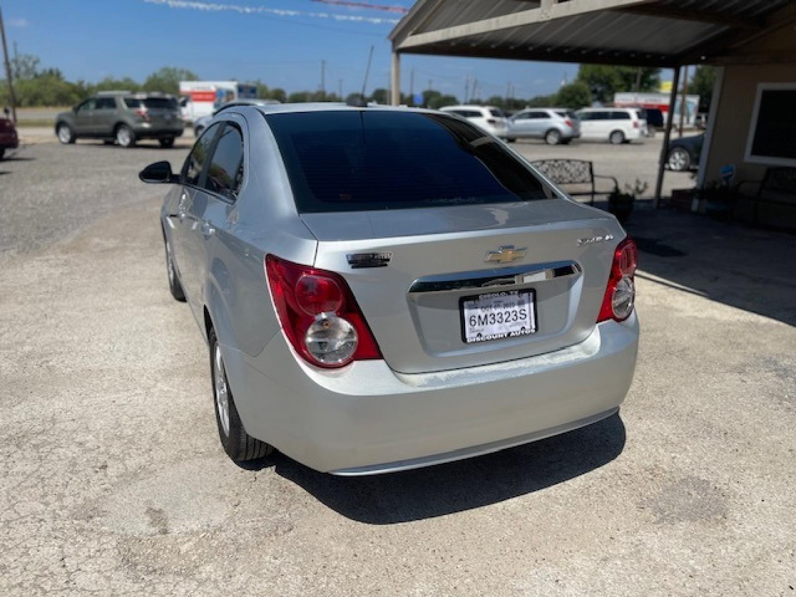 2015 SILVER CHEVROLET SONIC LT (1G1JC5SH6F4) with an 1.8L engine, Automatic transmission, located at 124 Elm St., Cibolo, TX, 78108, (210) 658-3118, 29.559427, -98.232384 - www.discountautosinc.com TEXT QUESTIONS TO 210-900-3118 35 MONTHLY PAYMENTS OF $295 WITH $1895 DOWN AND FINAL ODD PAYMENT OF $280.14 W/FIRST PAYMENT DUE 30 DAYS FROM DATE OF SALE. WARRANTY ON ENGINE and TRANSMISSION ONLY FOR 3 MONTHS OR 3,000 MLS. 36 MO'S TERM W/ 22.44 APR - Photo #1