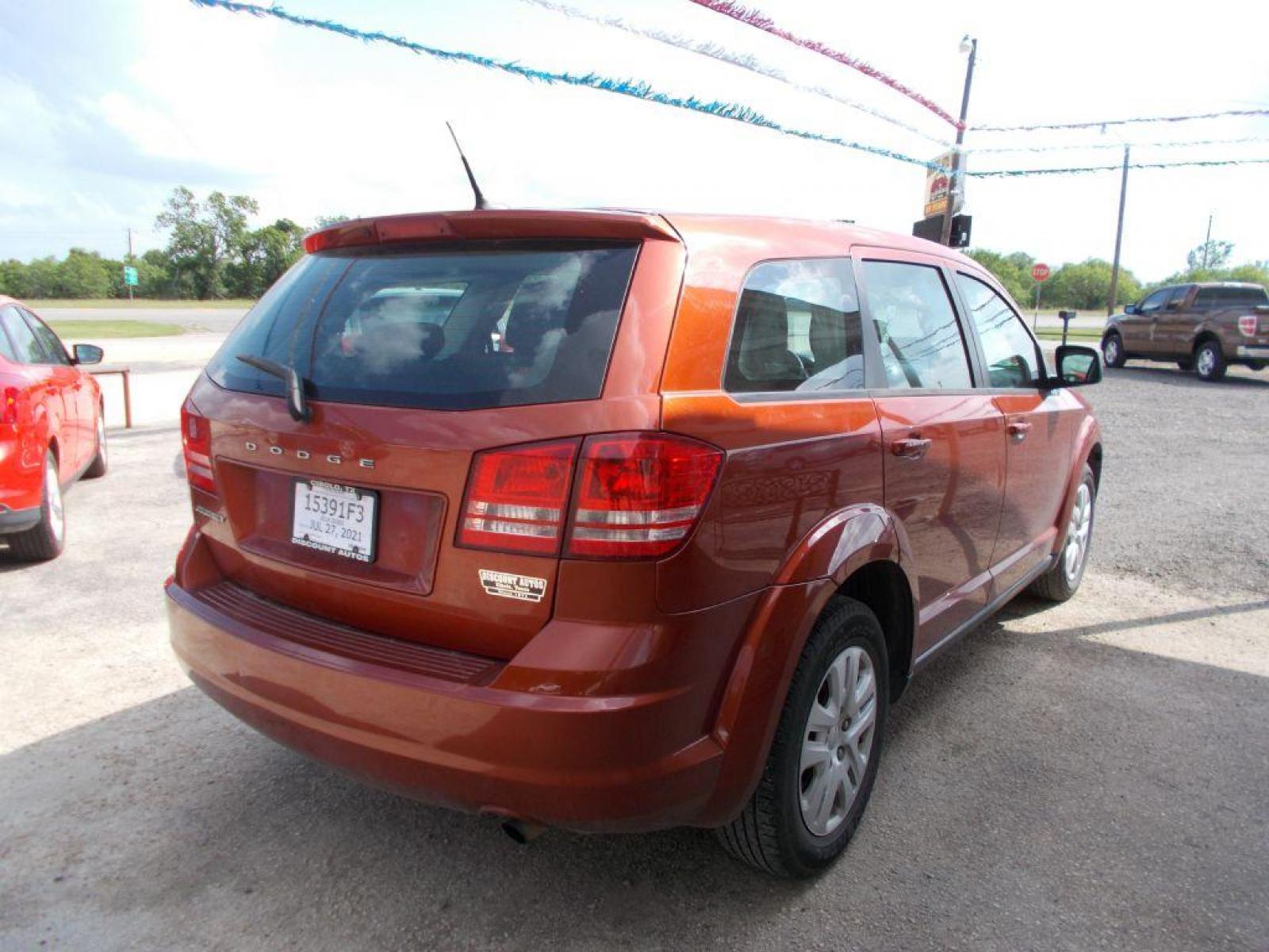 2014 ORANGE DODGE JOURNEY SE (3C4PDCAB0ET) with an 2.4L engine, Automatic transmission, located at 124 Elm St., Cibolo, TX, 78108, (210) 658-3118, 29.559427, -98.232384 - www.discountautosinc.com TEXT QUESTIONS TO 210-900-3118 35 MONTHLY PAYMENTS OF $320 WITH $1895 DOWN AND FINAL ODD PAYMENT OF $77.87 W/FIRST PAYMENT DUE 30 DAYS FROM DATE OF SALE. FEATURES: BLUE TOOTH, 3RD ROW SEATING WARRANTY ON ENGINE and TRANSMISSION ONLY FOR 3 MONTHS OR 3 - Photo #3