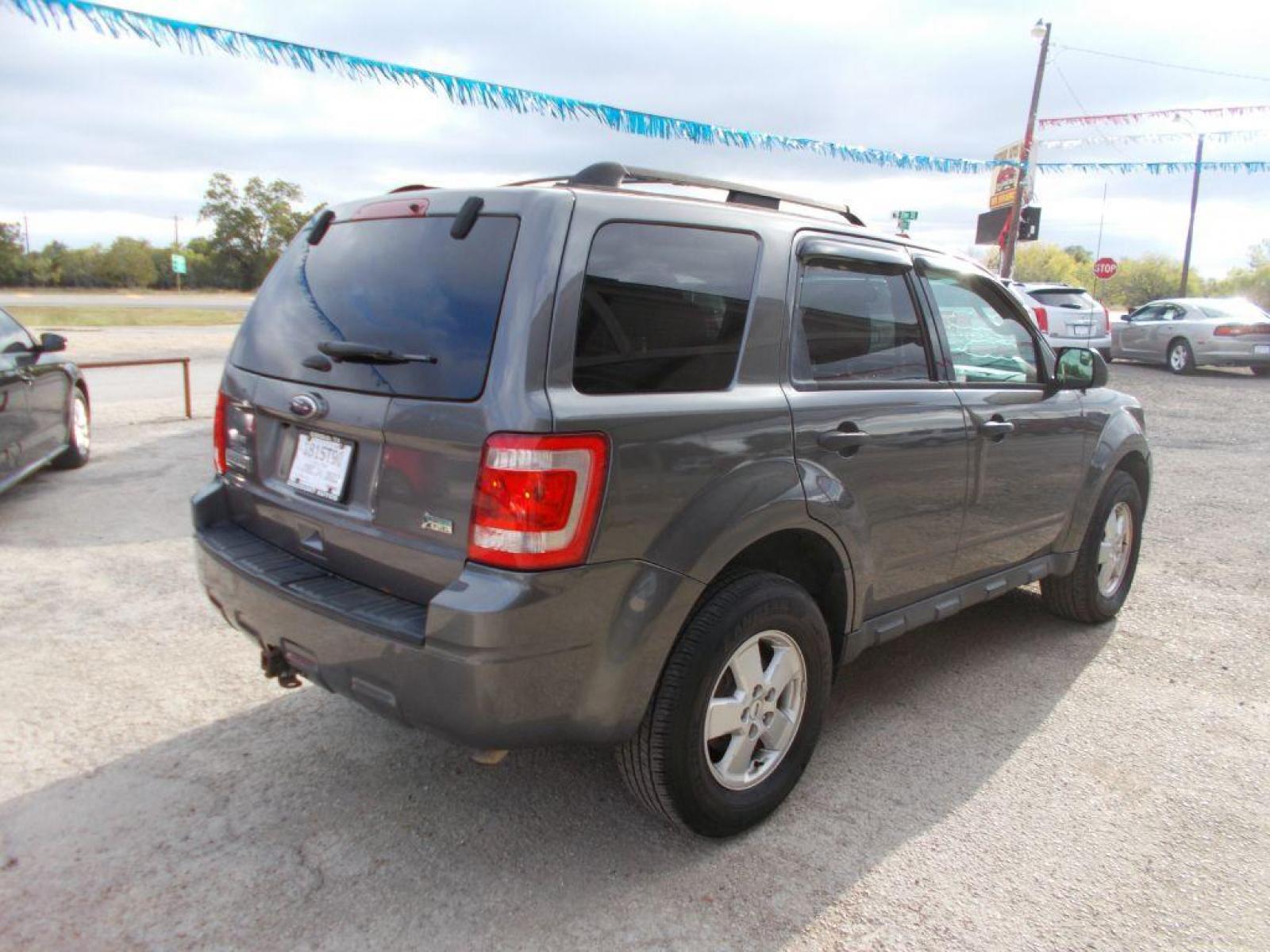 2012 GRAY FORD ESCAPE XLT (1FMCU9DG9CK) with an 3.0L engine, Automatic transmission, located at 124 Elm St., Cibolo, TX, 78108, (210) 658-3118, 29.559427, -98.232384 - www.discountautosinc.com TEXT QUESTIONS TO 210-900-3118 35 MONTHLY PAYMENTS OF $320 WITH $1895 DOWN AND FINAL ODD PAYMENT OF $69.11 W/FIRST PAYMENT DUE 30 DAYS FROM DATE OF SALE. FEATURES: BLUE TOOTH, SUN ROOF WARRANTY ON ENGINE and TRANSMISSION ONLY FOR 3 MONTHS OR 3,000 ML - Photo #17